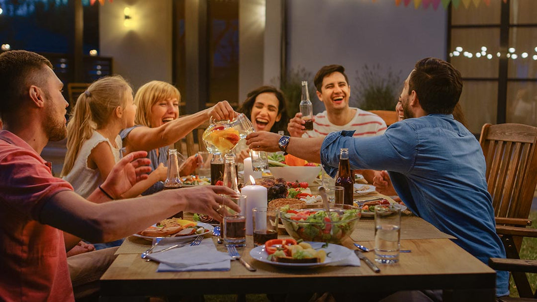 Family gathered around the table enjoying the holiday season.  Sustainable gardening products sold at Green Living Supply